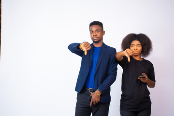 young black man and woman gesture their disapproval