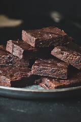 Pieces of chocolate brownie, food photo.