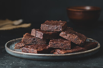 Pieces of chocolate brownie, food photo.