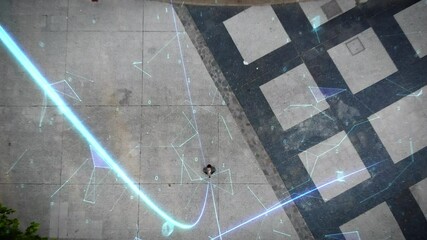 Overhead view of businessman using his smartphone on a big city full of traffic. Animation of bright lines representing concepts like Global Networks, Augmented Reality, Internet of Things. Drone shot - Powered by Adobe