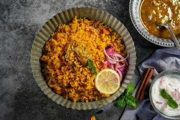 Irachi / Erachi choru chicken - Malabar meat rice served with raita and gravy