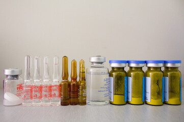 vials of medicine in a nursing room with white background 