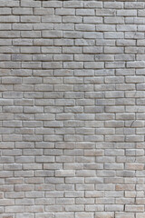 White brick wall background in rural room. Abstract weathered texture stained old stucco light gray. White grunge brick wall background. Misty brick wall for background or texture.