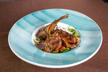 braised lamb rib with fresh salad on a plate
