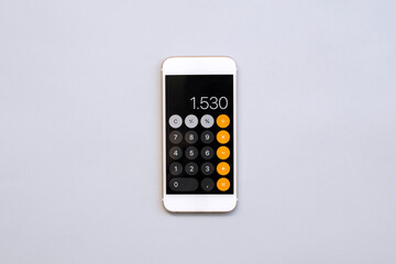 smart phone with calculator on gray background	 - obrazy, fototapety, plakaty