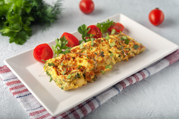 Fresh French omelet with fresh vegetables. Vegetarian food
