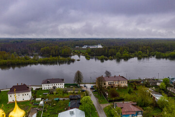 Fototapeta na wymiar a panoramic view of the river and the historic center of Gorokhovets during the rain filmed from a drone 