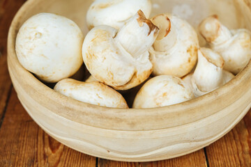 Large mushrooms. Mushrooms on a wooden background, cooking fresh mushrooms.