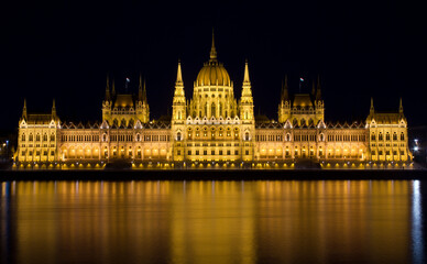 Hungarian Parliament by the river Danube at night.  