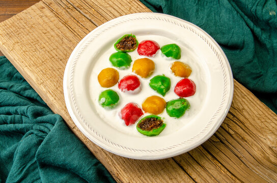 Badak Berendam is a popular dessert in Malaysia with sweet coconut inside and high demanded during the fasting month. Glutinous Rice Balls in Coconut Milk.