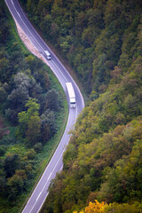 Highway along a mountain river top view.