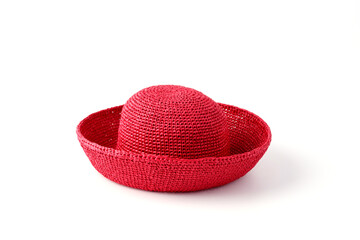 Beautiful straw hat, beautiful with a ribbon and bow on the beach hat, white background.Concept of fashion clothing accessories and beach holidays.Texture of summer straw hat from interwoven raffia.