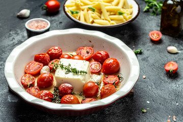 Baked feta pasta. Trending Feta bake pasta with cherry tomatoes, feta cheese, garlic and herbs. Long banner format, top view