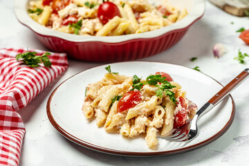 Homemade feta pasta, oven baked cherry tomatoes and feta cheese with olive oil, Food recipe background. Close up