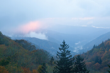 Sunrise in a mountain mist