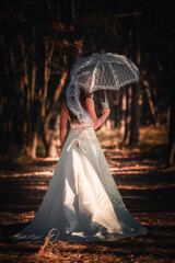 Woman in wedding dress ,photoshoot in forest