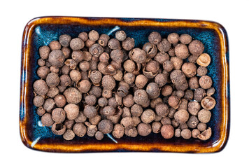 allspice (jamaica pepper) in ceramic bowl cutout