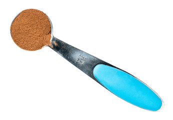 cinnamon powder in measuring teaspoon cutout