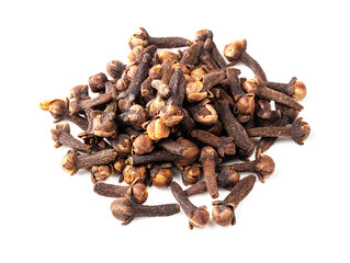 handful of dried cloves closeup on white