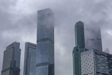 Glass skyscraper of the Moscow City business center in cloudy weather. Russia