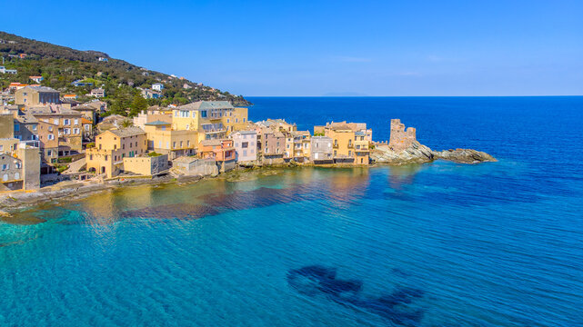 Corsica, Drone view of the village of Erbalunga and its Genoese tower. Erbalunga is a charming village of character on the Corsican coast, remarkable for its ruined Genoese tower 