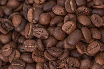 coffee beans and grinder on table with rustic background