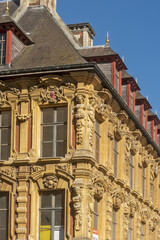 facade details of The Vieille Bourse, Old Stock Exchange in Lille, France