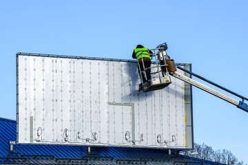 installation of a new large modern advertising stand with LED bulbs