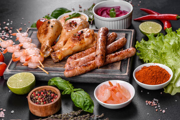 Composition of sausages, chicken, pork and shrimp prepared on grill, as well as vegetables prepared on grill with spices and herbs