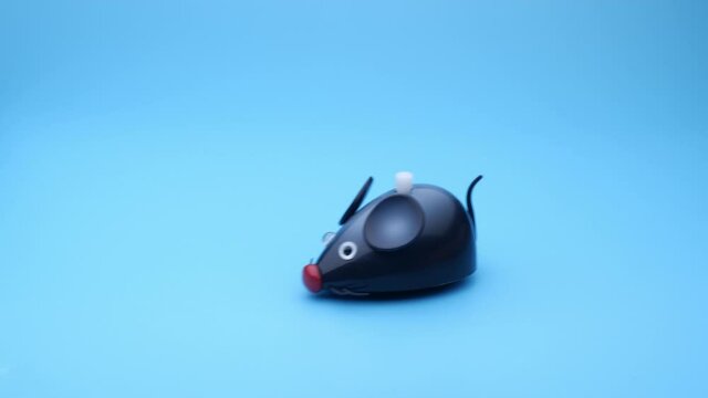 Clockwork mice runs on a blue background. Seamless loop.
