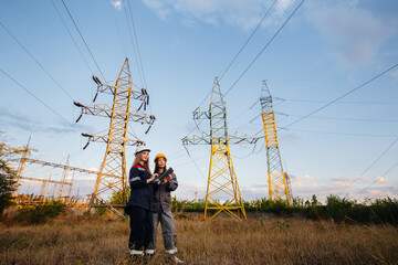 Women's collective of energy workers conducts an inspection of equipment and power lines. Energy