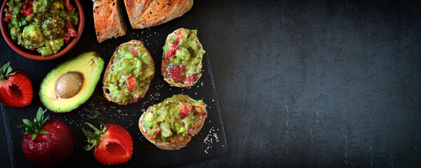 Toast with strawberry guacamole. Healthy summer snack. Avocado with strawberries. Keto diet toast.