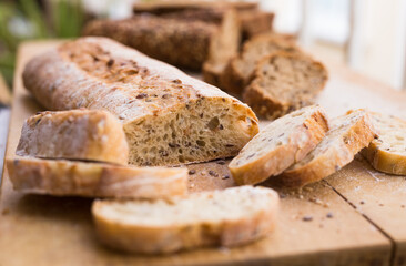 fresh loaf of bread on wooden board
