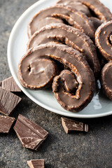 Sweet pastry palmeritas with chocolate icing.