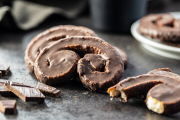Sweet pastry palmeritas with chocolate icing.