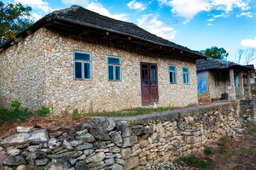 Rustic houses with rubble walls . Settlement of poor people