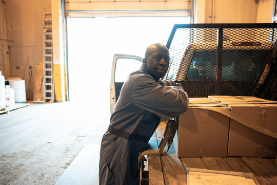 Portrait of truck driver in distribution warehouse