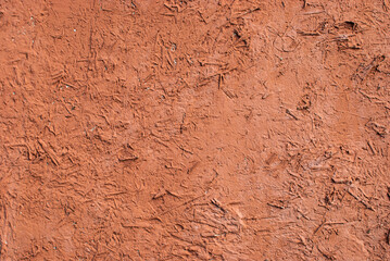 Old vintage adobe rustic style clay wall closeup as background