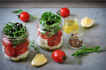 Salads in jars. Healthy salad with feta and arugula. Summer snack to go.