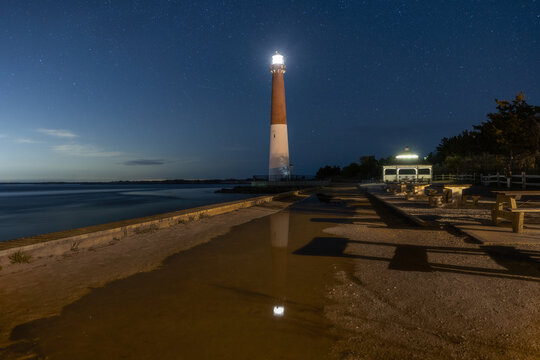 Dark starry night sky over Barnegat Lighthouse on the Jersey shore. 