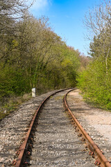 Fototapeta na wymiar Single track branch line of a railway through a rural area. No people.