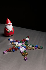 Mini santa claus on gray metal table