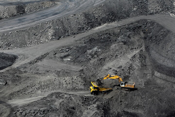 Machines working in open pit coal mine