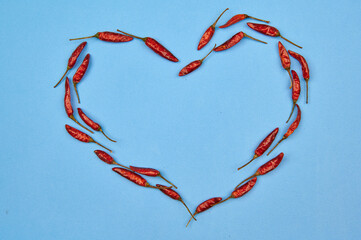 hot pepper heart on a blue background with a place to insert