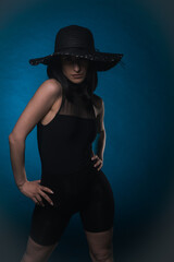 Fototapeta na wymiar Elegant woman is posing with hat