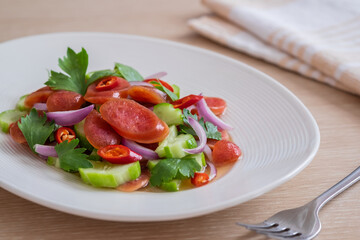 Spicy chinese pork sausage salad on plate, Thai food