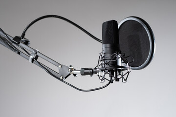 Studio microphone close-up. Condenser microphone with pop filter. Sound recording concept....