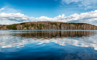 Vlasina lake scenery with beautiful clouds in the blue sky. Beautiful semi-artificial lake in Southeast Serbia