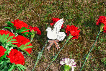 A paper pigeon with a St. George ribbon, made by the hands of a child in honor of the fallen...
