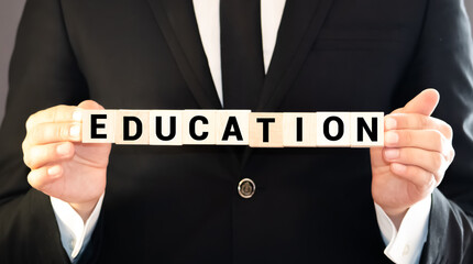 Education spelled out with wooden blocks and exclamation mark.